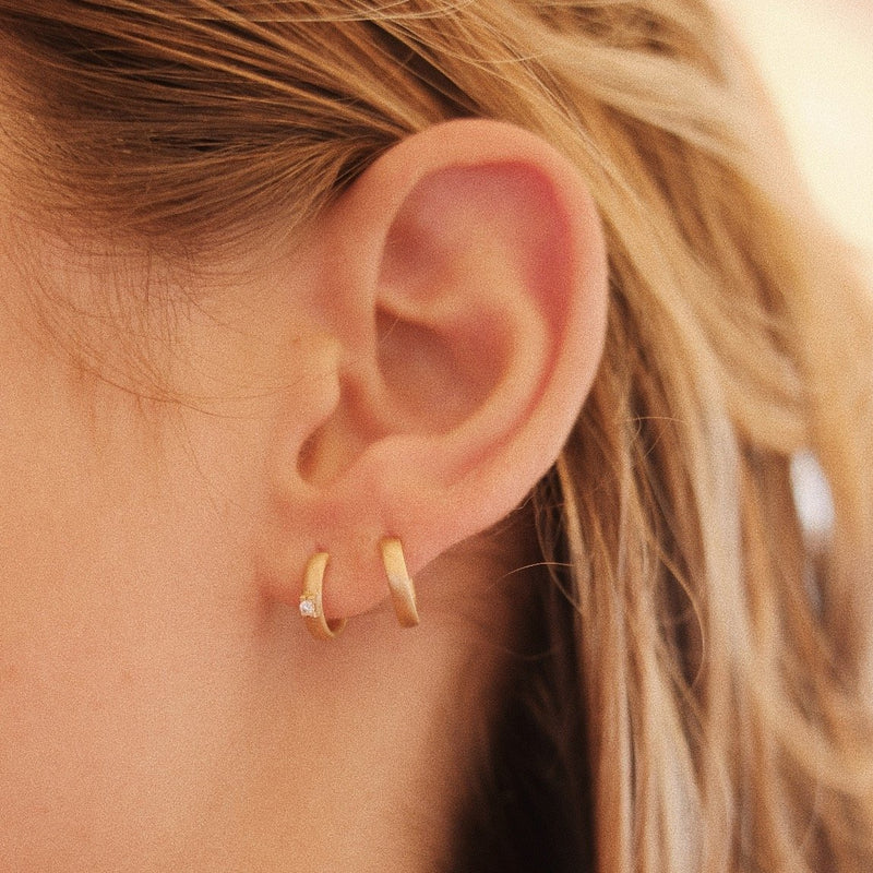 Styling multiple gold earrings with diamonds | Pinpoint | Lil Milan